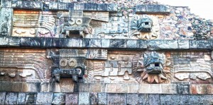 The giant serpent heads wear a feathered collar and decorate the pyramid side alternating with the serpent and then God Tlaloc – the God of Rains. When you look at the stone carvings remember that they were painted bright colors – likely deep reds and blues.