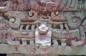 "Besides illustrating the opposite and complementary aspects of the underworld, Balamkú's frieze compares dynastic and solar cycles. The king raises from the earth monster's maw, just as the Sun emerges from the Earth's mouth. The ruler's death is seen as if it were a sunset, when he falls into the monster's mouth.