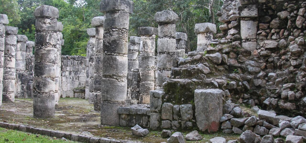 Rows of stone columns create layers of depth among the surviving walls.