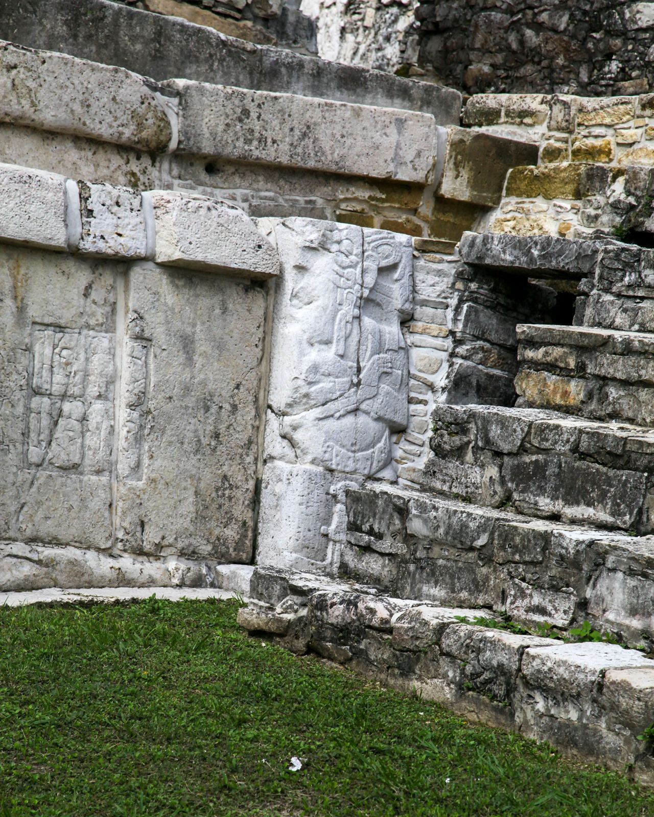 A carved figure beside the steps rewards a closer look.