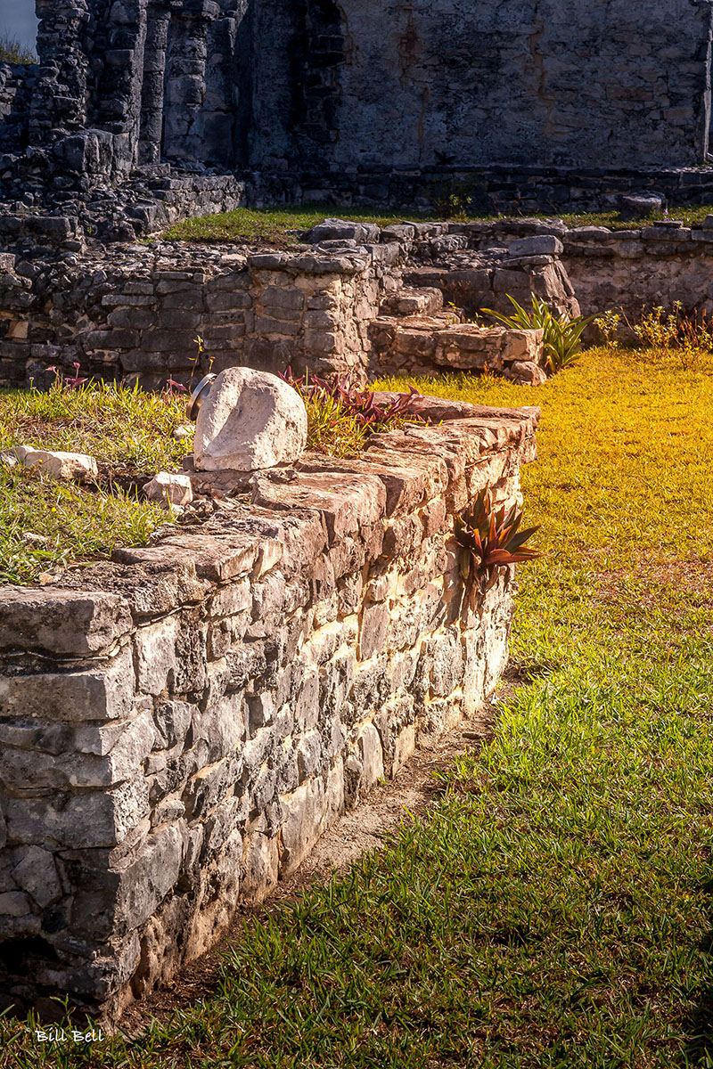A low stone wall creates a strong diagonal at Tulum.